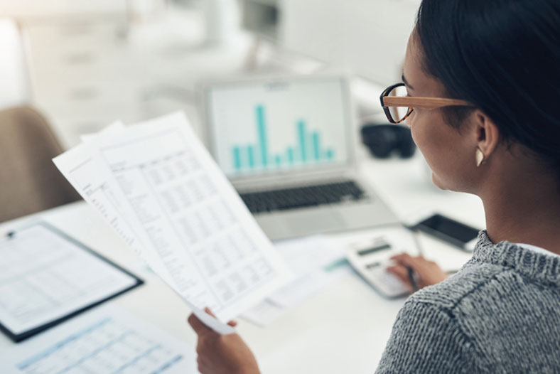 woman calculating in the office